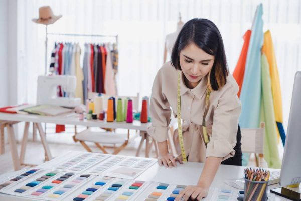 designer-are-thinking-designing-clothes-customers-order-items-designer-desk-studio-clothes-designers-are-working-office-startup-designer-concept.jpg